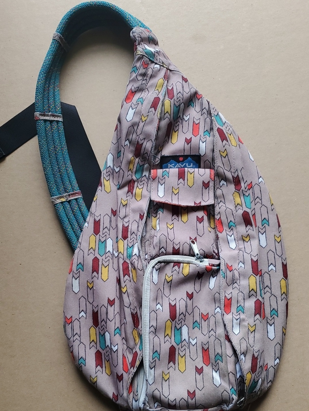 Kavu Teal-Strap Sling Bag with Taupe Multicolor Arrow Print
